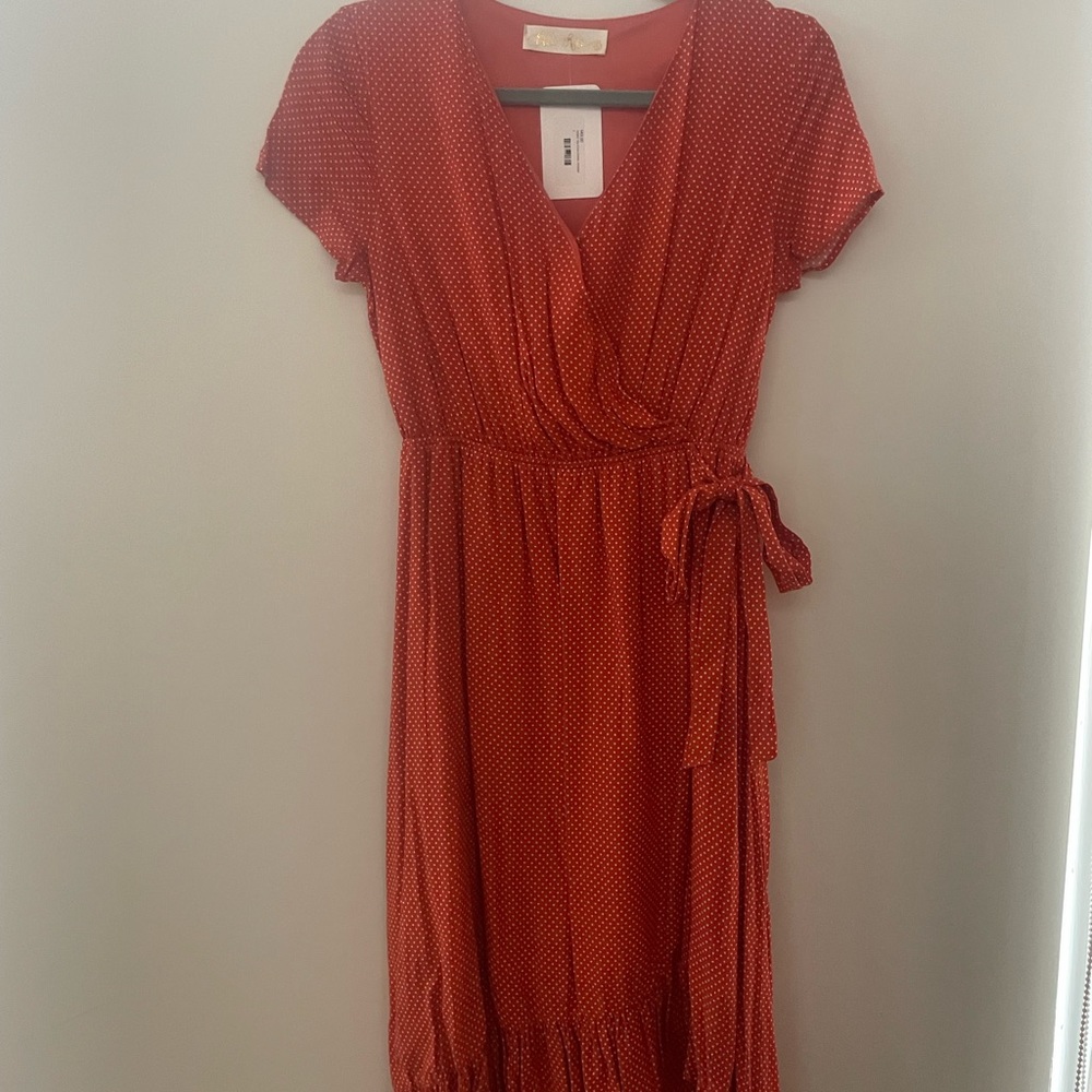 Women orange and white polka dot dress. New with tags.